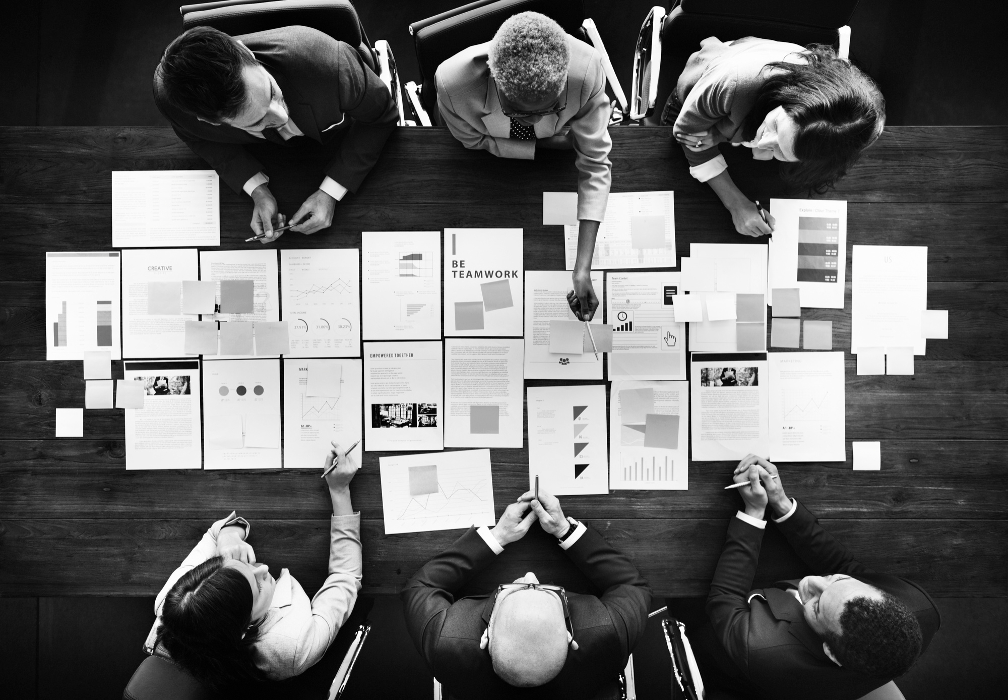 business-people-analyzing-statistics-financial-concept (1)